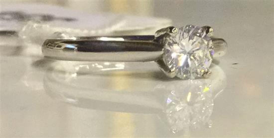 An 18ct white gold and solitaire diamond ring, size K.
